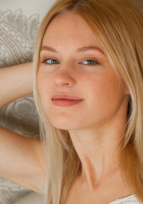 Slender blond youthful Xena in shorts exhibits her ass and spreads her legs 