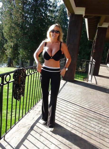 Hot american wife Sandra Otterson exposing big titties and hot ass outside